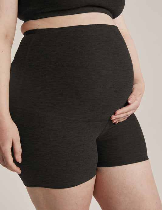 Woman wearing Gray Spacedye™ All For Run Maternity Short in a side profile, paired with a matching marled crop top.