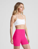 Fuchsia Spacedye Keep Pace 5" Biker Short with high waistband on a model in a white sports bra against a plain background.