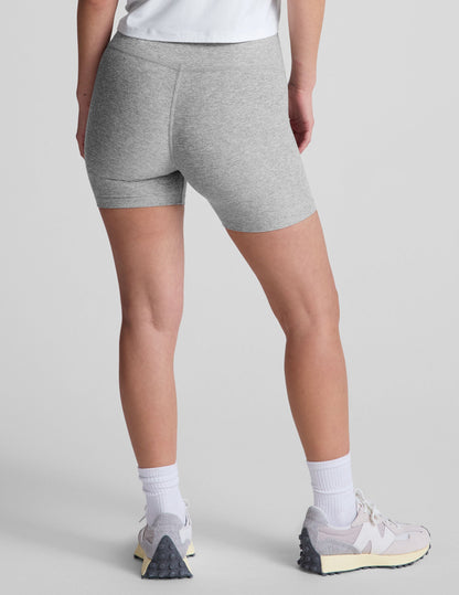 Rear view of a model in the gray marled Spacedye Keep Pace 5" Short, featuring a high waist and snug mid-thigh fit.