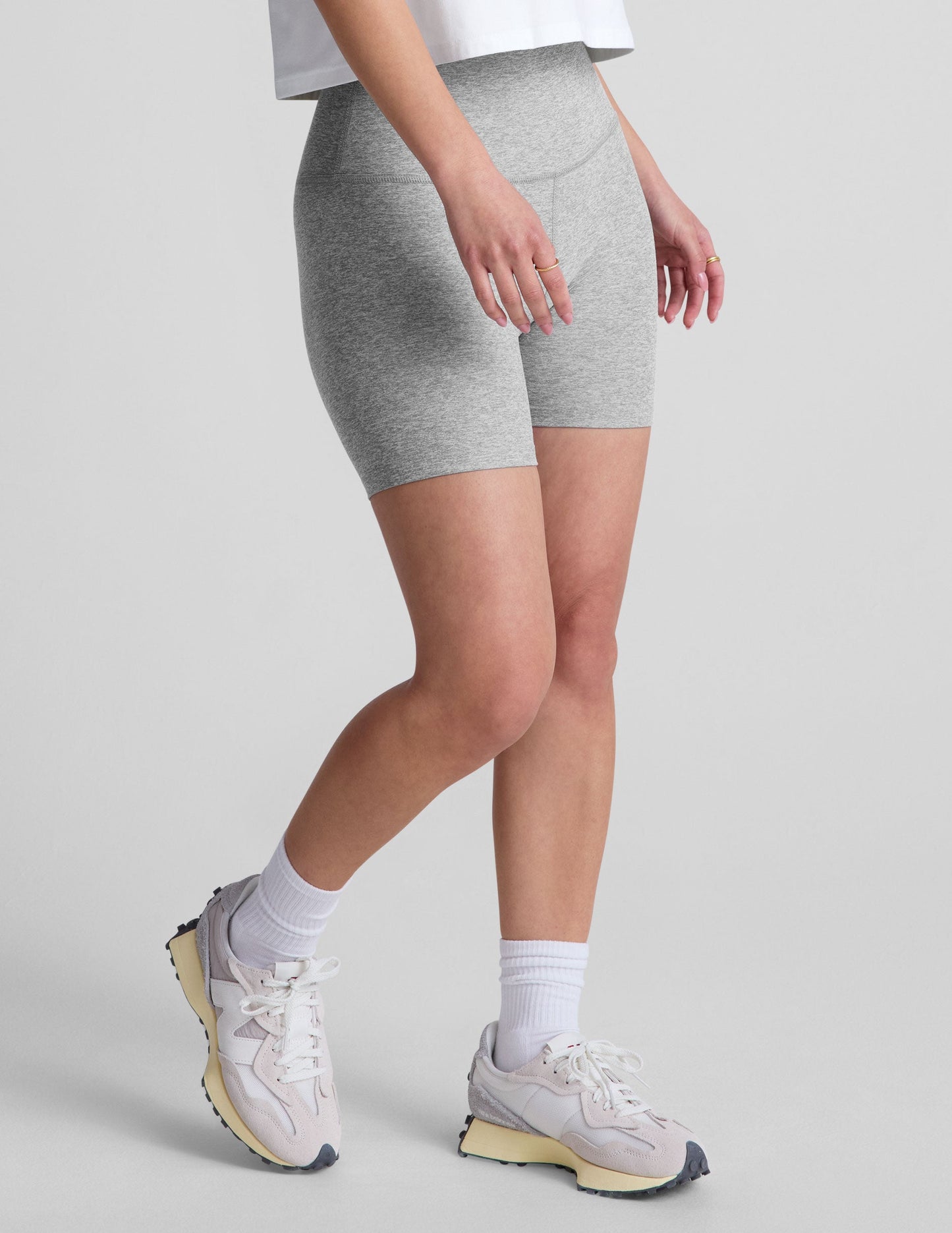 Side view of gray marled Spacedye Keep Pace 5" Short on a model, showing the high waistband and seamless mid-thigh fit.