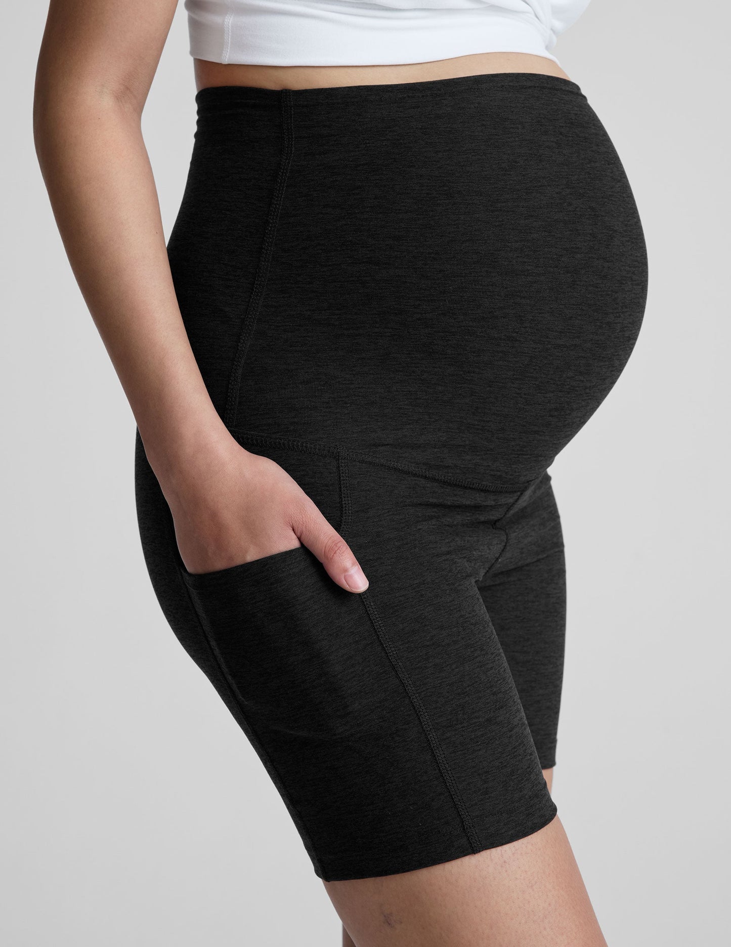 Black marled Spacedye Keep Pace 5" Maternity Pocket Biker Short with high over-the-bump waistband and side pocket.