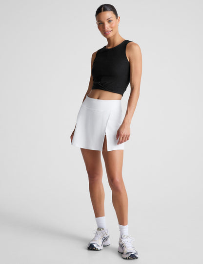 White Spacedye Points Crossover Skirt on a model, featuring a high waistband, A-line fit, and an overlap slit at the side.