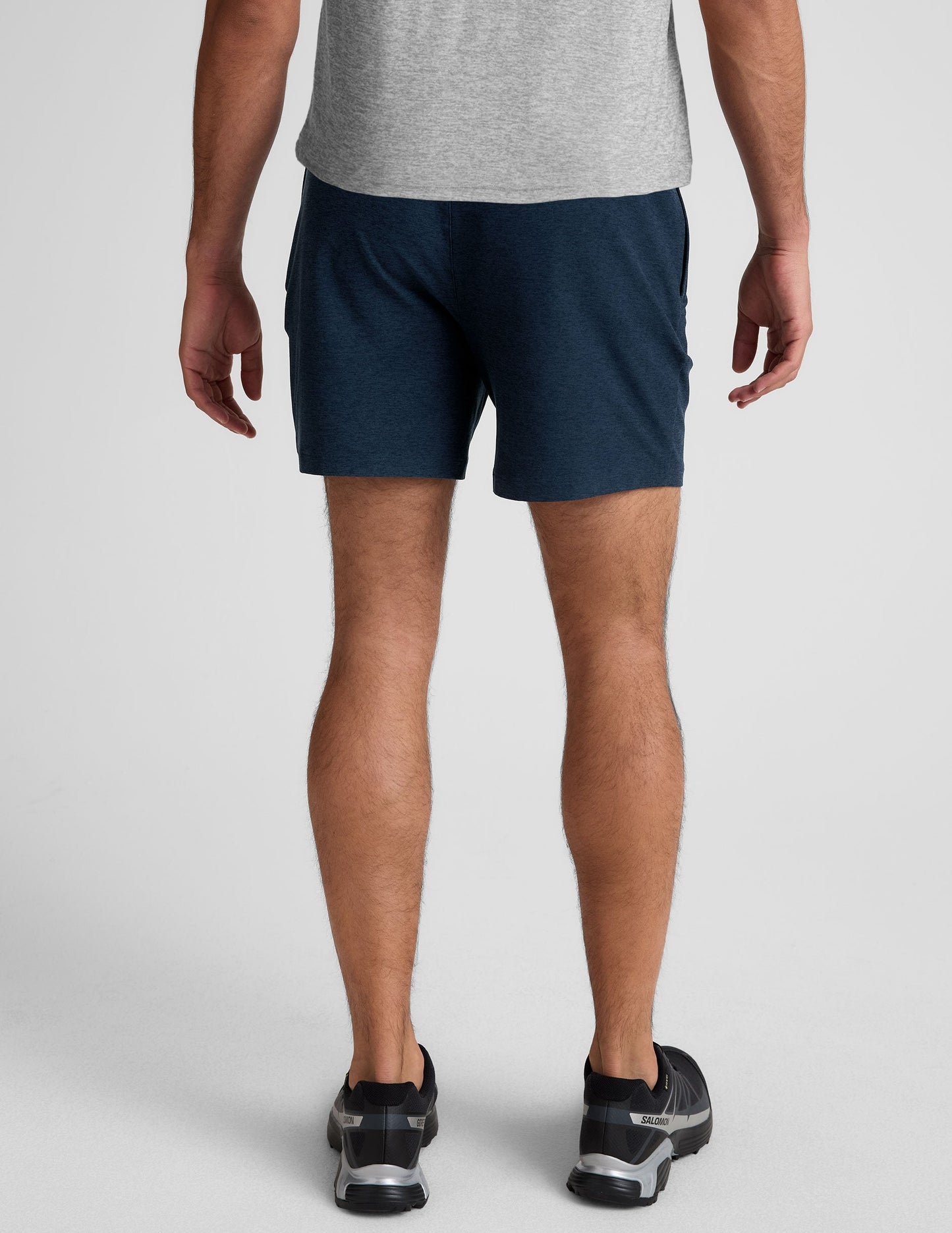 Rear view of navy marled Spacedye Unlimited Men's Short with an elastic waistband and relaxed mid-thigh fit.