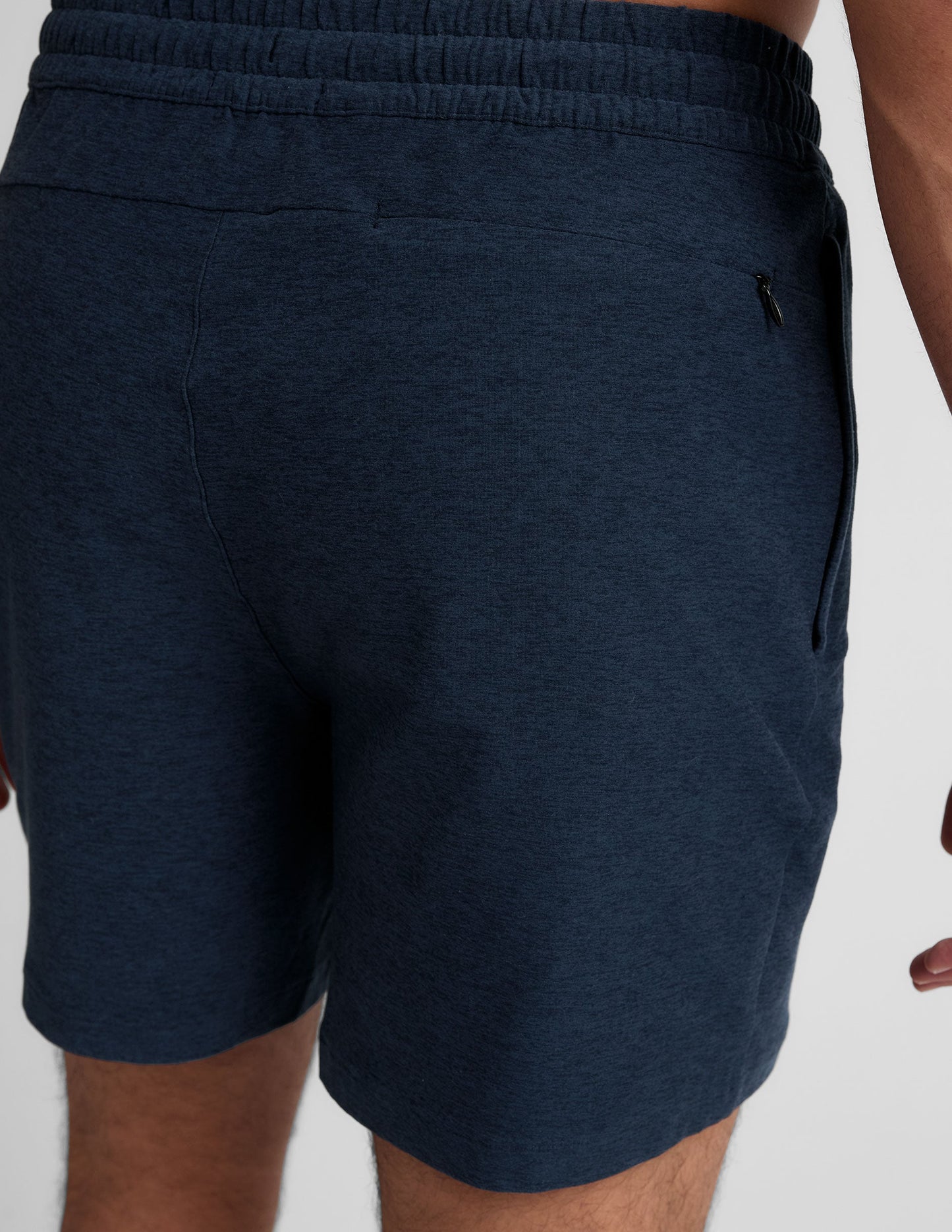 Rear view of navy marled Spacedye Unlimited Men's Short showing elastic waistband and back invisible zipper pocket.