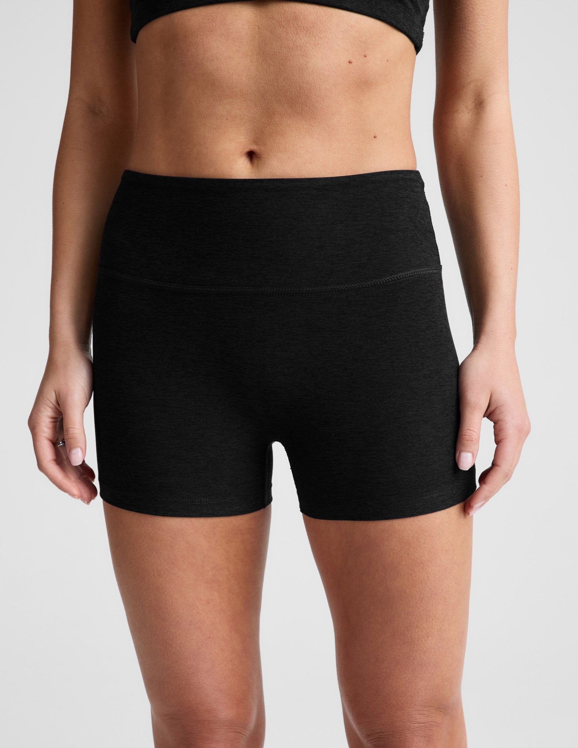 Front view of Spacedye Keep Pace 3" Mid-Rise Short in black, showing the wide waistband and snug, short-cut athletic fit.
