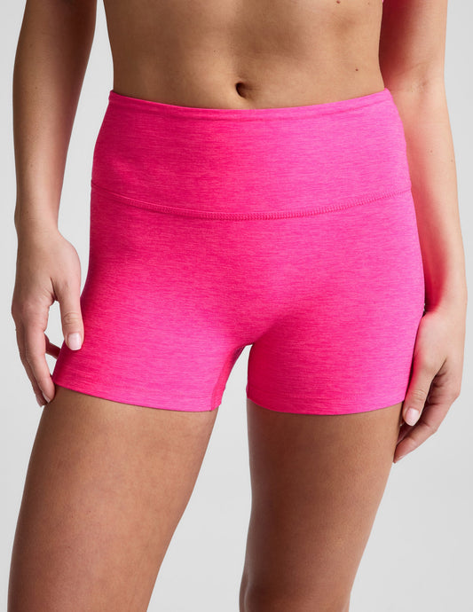 Woman wearing Fuchsia Spacedye™ Keep Pace 3" Mid-Rise Short paired with a sports bra.