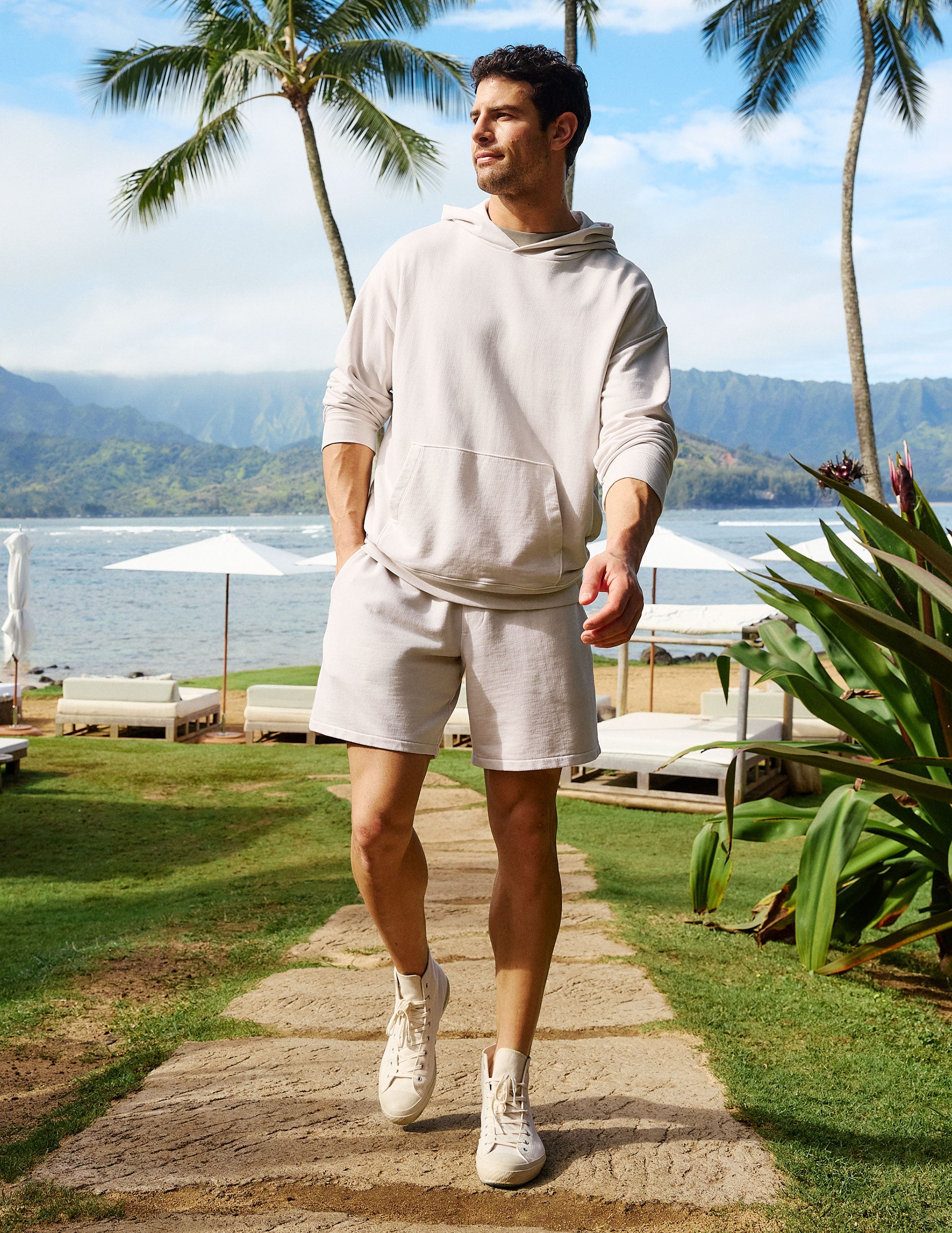 Man wearing Cream Beach Washed Terry Men's Short™ paired with a matching cream hoodie and high-top sneakers.