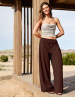 Woman wearing Brown Solstice™ Drawstring Wide Leg Pant 29" paired with a grey cowl neck tank top.
