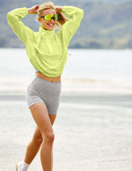 Woman wearing Gray Spacedye™ Streamline 5" Short paired with a lime green windbreaker and white sneakers.