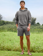 Man wearing Gray Beach Washed Terry Men's Short™ paired with a matching hoodie and brown sandals in a grassy field.
