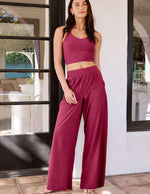 Woman wearing Fuchsia Easy Wide Leg Pant 29"™ paired with a matching tank top and side seam pockets.
