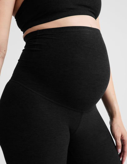Woman wearing Black Spacedye™ Love The Bump Maternity 20.5" Capri Legging with a matching black crop top.
